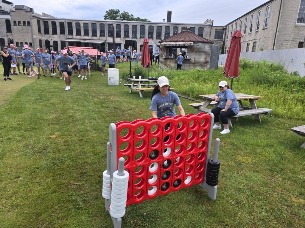 Participants are engaging in a large outdoor Connect Four game, a other popular activity in the 