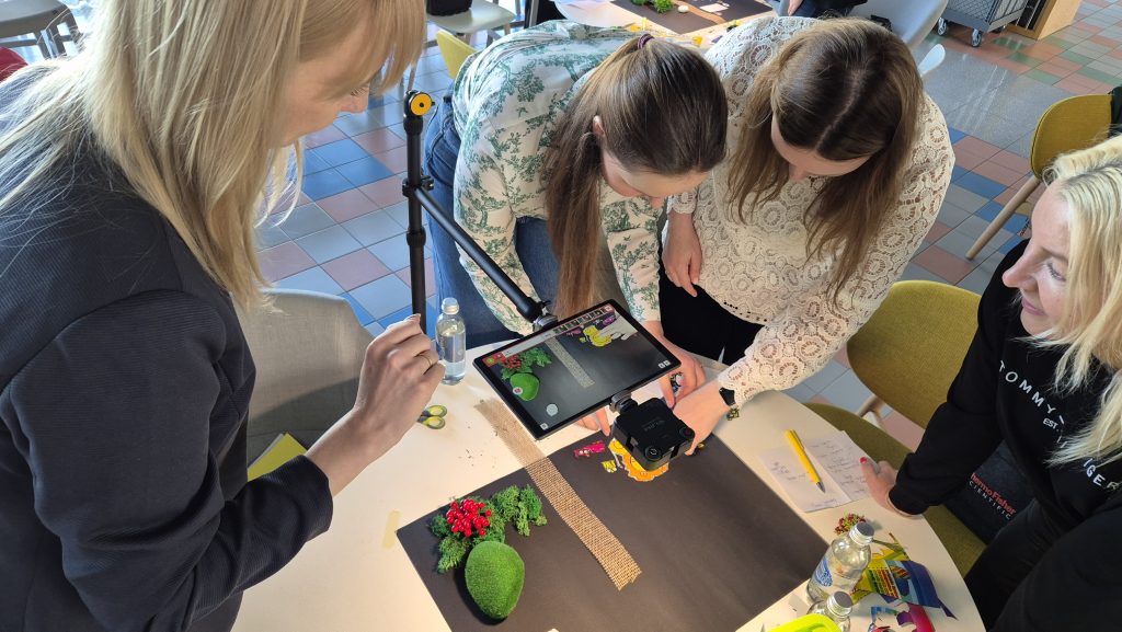 Team building activity using stop motion animation. Participants collaborate on a creative project, filming frame by frame to produce a seamless short film, emphasizing teamwork, communication, and storytelling.