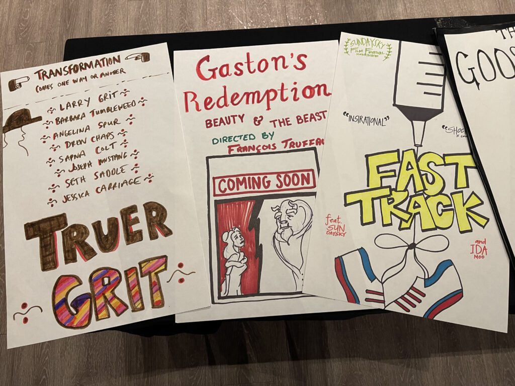 Hand-drawn movie posters for fictional films, including 'Truer Grit,' 'Gaston's Redemption,' and 'Fast Track,' created by participants during a creative team building event.