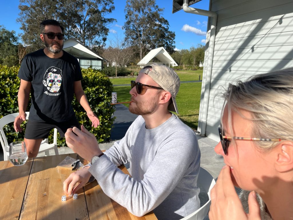 Team members participating in a fun outdoor team building activity, collaborating and strategizing. The event encourages teamwork, communication, and friendly competition in a relaxed setting.