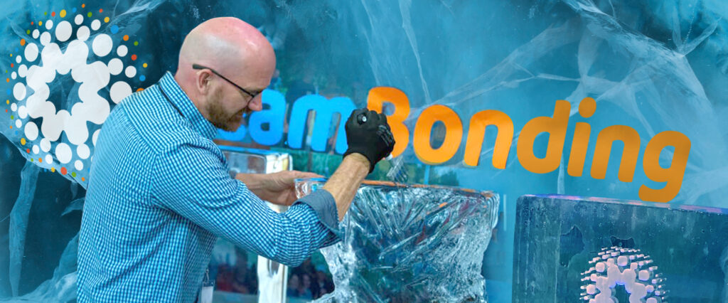 A participant works on an ice sculpture while taking part in a Team building Ice Sculpting event, showcasing creativity and teamwork.